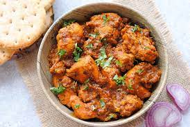 Chicken achari (tender chicken cooked  with gravy)