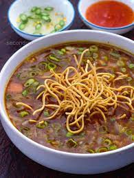 Manchow Soup (Veg stock coocked with chinese souse and choped veg served with Fried noodles)