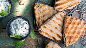 Stuffed parantha with yoghurt