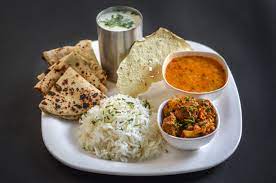 (6 Ghee Roti / Butter Paratha, 2 Sabji - jira, Rice-dal, Fry- Chhas- Salad- Sweet)