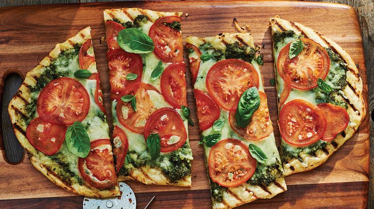 Grilled pizza with greens and tomatoes